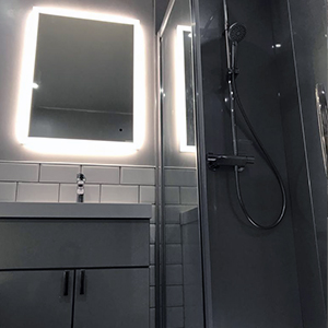 Mirror and enclosure fitted